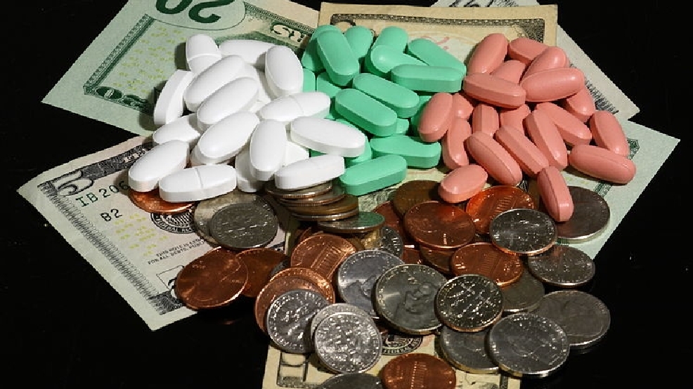 749px-Money_and_pills_in_three_colors.jpg
