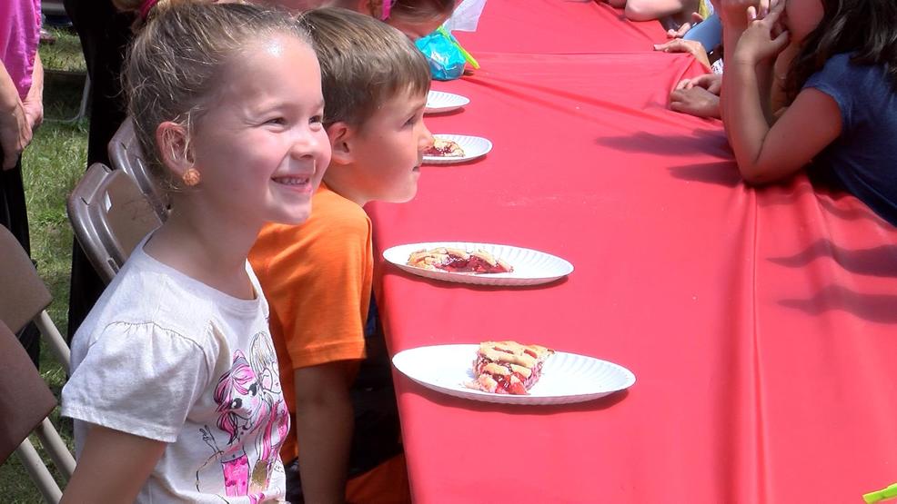 Kids of all ages stuff their faces during National Cherry Festival Pie